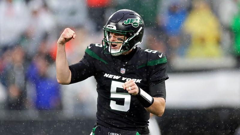 New York Jets quarterback Mike White (5) reacts to a touchdown against the Chicago Bears...