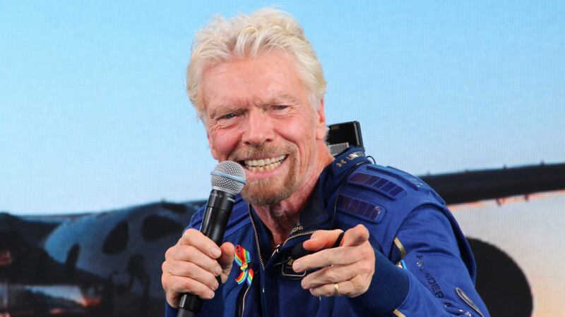 FILE - Virgin Galactic founder Richard Branson answers students' questions during a news...