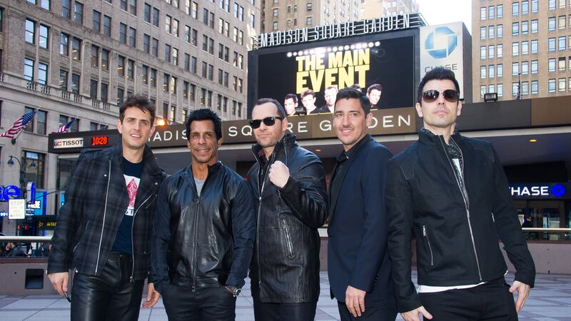 FILE - New Kids Kids On The Block members, from left, Joey McIntyre, Danny Wood, Donnie...