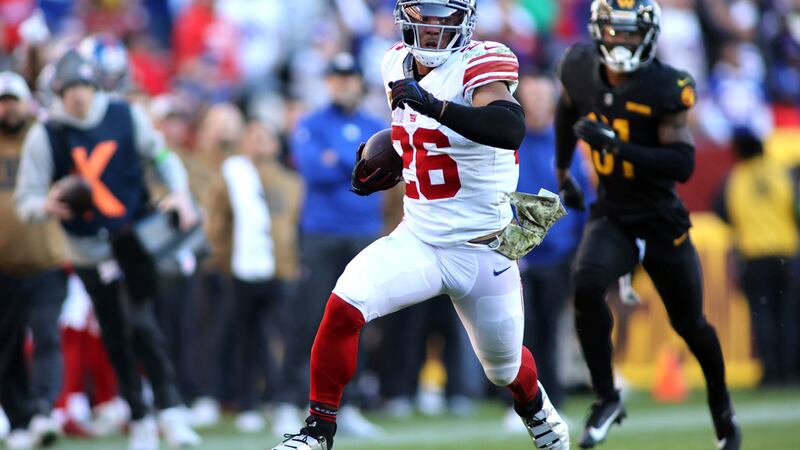 New York Giants running back Saquon Barkley (26) runs during an NFL football game against the...