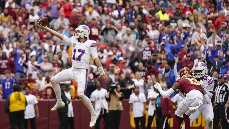 Buffalo Bills quarterback Josh Allen 917) leaping into the endzone to score a touchdown...